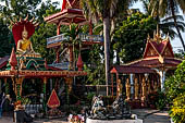 Vientiane, Laos - Pha That Luang, Other structures on the ground include a bell tower, several stupas, a number of pavilions sheltering images of the Buddha.  